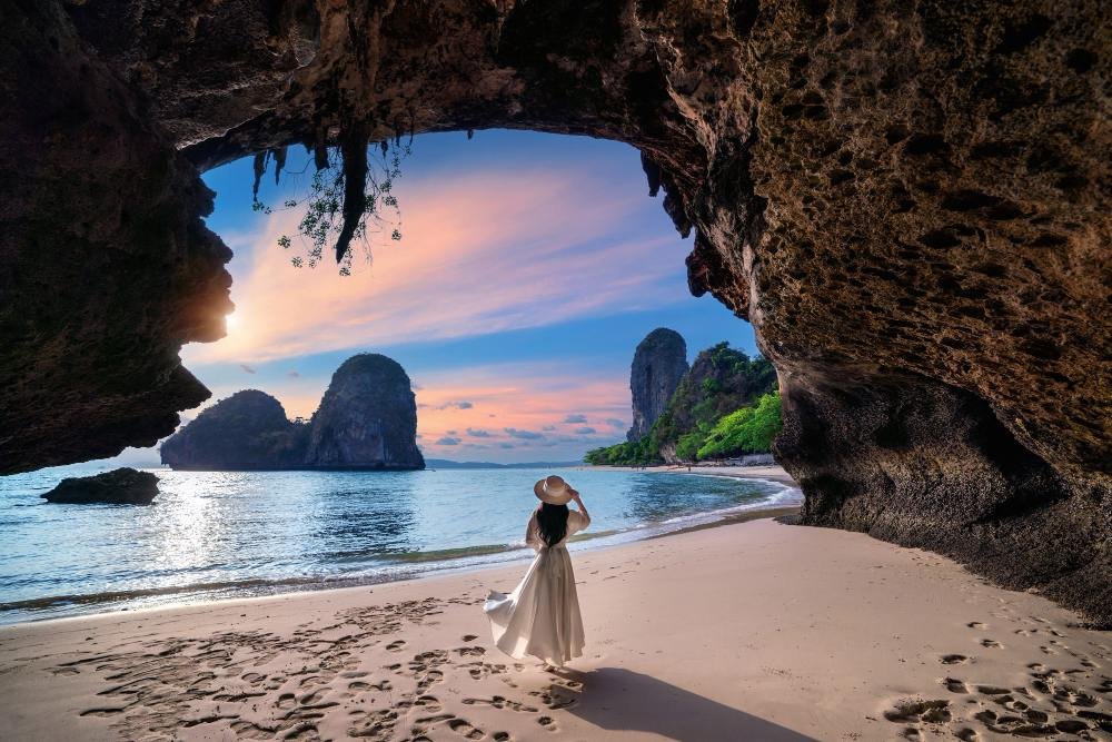 Phra Nang cave beach at sunset, framed by overhanging rock, Railay, Krabi